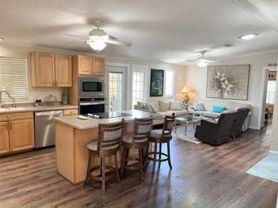 Absolutely stunning 2-bd, 2-ba home with modern updates & a on Del Tura Golf and Country Club in Florida - for sale on GolfHomes.com, golf home, golf lot