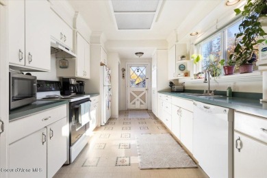 Welcome to this delightful classic downtown Coeur d'Alene home on Coeur D Alene Resort Golf Course in Idaho - for sale on GolfHomes.com, golf home, golf lot