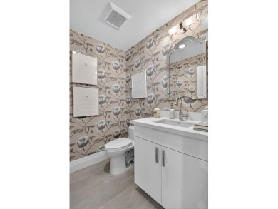 This contemporary home  is truly one of a kind, offering a WOW on Bocaire Country Club in Florida - for sale on GolfHomes.com, golf home, golf lot