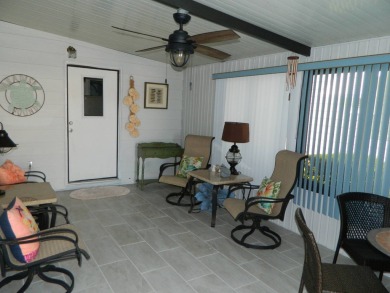 1,801 sq. ft. 2 bed/2 bath 1986 Redman 26x52 features a lanai on on Grasslands Golf and Country Club in Florida - for sale on GolfHomes.com, golf home, golf lot