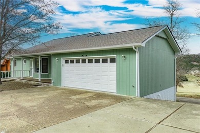 This beautifully updated home offers a prime golf course setting on Holiday Island Executive Golf Course in Arkansas - for sale on GolfHomes.com, golf home, golf lot