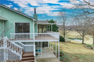 This beautifully updated home offers a prime golf course setting on Holiday Island Executive Golf Course in Arkansas - for sale on GolfHomes.com, golf home, golf lot