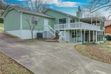 This beautifully updated home offers a prime golf course setting on Holiday Island Executive Golf Course in Arkansas - for sale on GolfHomes.com, golf home, golf lot