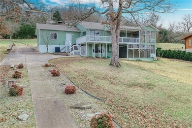 This beautifully updated home offers a prime golf course setting on Holiday Island Executive Golf Course in Arkansas - for sale on GolfHomes.com, golf home, golf lot