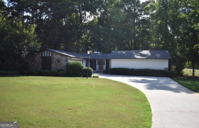 Welcome to your dream home overlooking Hole 2 of the prestigious on Honey Creek Country Club in Georgia - for sale on GolfHomes.com, golf home, golf lot