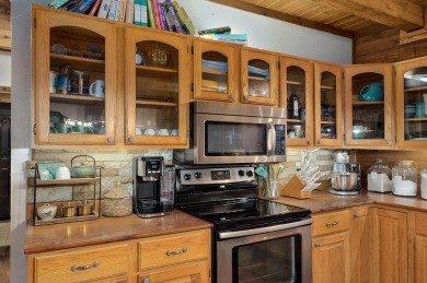 One-of-a-Kind Log Home - Walking Distance To Lake Taneycomo - on Thousand Hills Golf Resort in Missouri - for sale on GolfHomes.com, golf home, golf lot