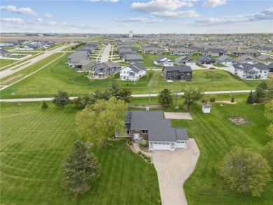 This stunning 4-bedroom, 2.5-bath home sits on a rare double lot on Hunters Ridge Golf Course in Iowa - for sale on GolfHomes.com, golf home, golf lot