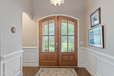 Step into luxury coastal living with this impeccable residence on Members Club At St. James Plantation in North Carolina - for sale on GolfHomes.com, golf home, golf lot