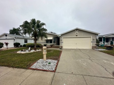 Beautiful stucco home on the exterior perimeter.  Updated on Del Tura Golf and Country Club in Florida - for sale on GolfHomes.com, golf home, golf lot