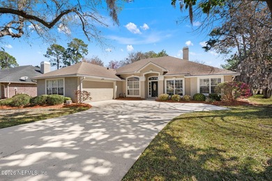 Beautiful 4-bedroom, 3-bath home overlooking the water and the on Eagle Harbor Golf Club in Florida - for sale on GolfHomes.com, golf home, golf lot