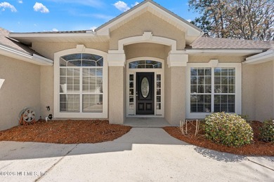 Beautiful 4-bedroom, 3-bath home overlooking the water and the on Eagle Harbor Golf Club in Florida - for sale on GolfHomes.com, golf home, golf lot