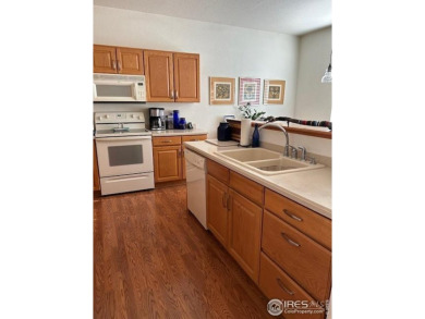 Check out this spacious & sunny end unit w/golf course views! It on The Broadlands Golf Course in Colorado - for sale on GolfHomes.com, golf home, golf lot