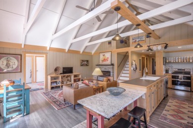 Settle into this charming mountain home overlooking the 11th on Angel Fire Resort Country Club in New Mexico - for sale on GolfHomes.com, golf home, golf lot