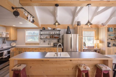 Settle into this charming mountain home overlooking the 11th on Angel Fire Resort Country Club in New Mexico - for sale on GolfHomes.com, golf home, golf lot