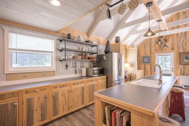 Settle into this charming mountain home overlooking the 11th on Angel Fire Resort Country Club in New Mexico - for sale on GolfHomes.com, golf home, golf lot