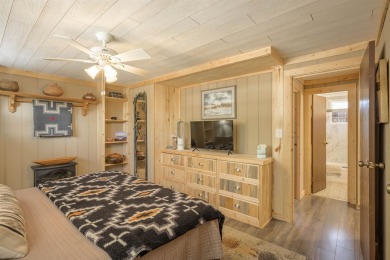 Settle into this charming mountain home overlooking the 11th on Angel Fire Resort Country Club in New Mexico - for sale on GolfHomes.com, golf home, golf lot