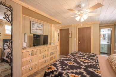 Settle into this charming mountain home overlooking the 11th on Angel Fire Resort Country Club in New Mexico - for sale on GolfHomes.com, golf home, golf lot