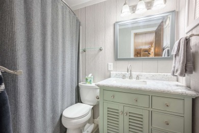 Settle into this charming mountain home overlooking the 11th on Angel Fire Resort Country Club in New Mexico - for sale on GolfHomes.com, golf home, golf lot