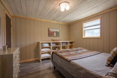 Settle into this charming mountain home overlooking the 11th on Angel Fire Resort Country Club in New Mexico - for sale on GolfHomes.com, golf home, golf lot