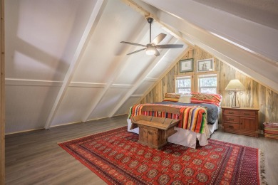 Settle into this charming mountain home overlooking the 11th on Angel Fire Resort Country Club in New Mexico - for sale on GolfHomes.com, golf home, golf lot