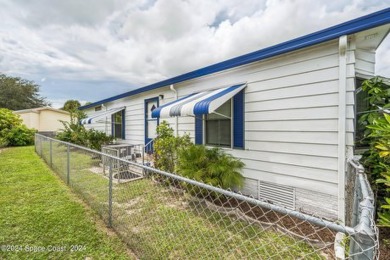 Beautiful, remodeled 2 bedroom/ 2 bathroom home with a carport on Barefoot Bay Golf Course in Florida - for sale on GolfHomes.com, golf home, golf lot