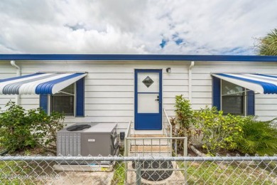 Beautiful, remodeled 2 bedroom/ 2 bathroom home with a carport on Barefoot Bay Golf Course in Florida - for sale on GolfHomes.com, golf home, golf lot