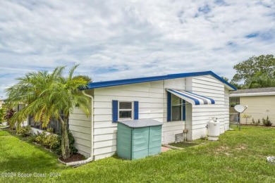 Beautiful, remodeled 2 bedroom/ 2 bathroom home with a carport on Barefoot Bay Golf Course in Florida - for sale on GolfHomes.com, golf home, golf lot