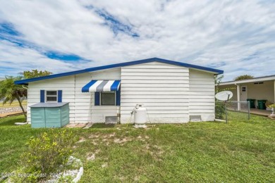 Beautiful, remodeled 2 bedroom/ 2 bathroom home with a carport on Barefoot Bay Golf Course in Florida - for sale on GolfHomes.com, golf home, golf lot