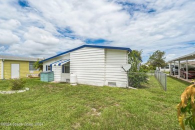 Beautiful, remodeled 2 bedroom/ 2 bathroom home with a carport on Barefoot Bay Golf Course in Florida - for sale on GolfHomes.com, golf home, golf lot