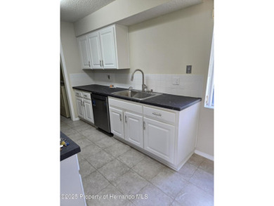 Priced to sell. Nice, first floor unit, 2/2 with enclosed porch on Heather Golf and Country Club in Florida - for sale on GolfHomes.com, golf home, golf lot