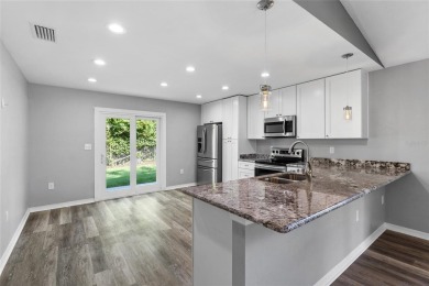 Welcome to this beautifully updated 3-bedroom, 2-bathroom home on Turkey Creek Golf and Country Club in Florida - for sale on GolfHomes.com, golf home, golf lot