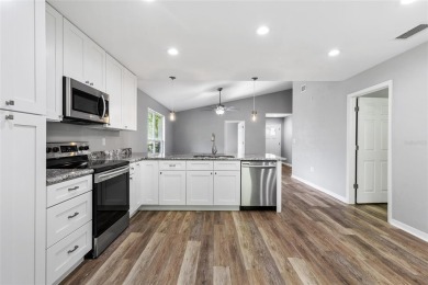 Welcome to this beautifully updated 3-bedroom, 2-bathroom home on Turkey Creek Golf and Country Club in Florida - for sale on GolfHomes.com, golf home, golf lot