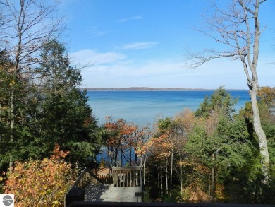 EAST BAY WATERFRONT HOME! Great  East Bay & Sunset Views! 103 Ft on Lochen Heath Golf Course in Michigan - for sale on GolfHomes.com, golf home, golf lot