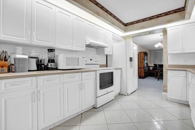 Enjoy the best of 55+ living in this lovely 2-bedroom, 2-bath on Wynmoor Golf Course in Florida - for sale on GolfHomes.com, golf home, golf lot