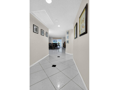 Enjoy the best of 55+ living in this lovely 2-bedroom, 2-bath on Wynmoor Golf Course in Florida - for sale on GolfHomes.com, golf home, golf lot