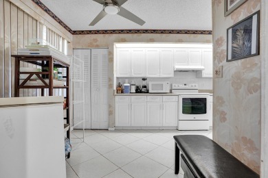 Enjoy the best of 55+ living in this lovely 2-bedroom, 2-bath on Wynmoor Golf Course in Florida - for sale on GolfHomes.com, golf home, golf lot