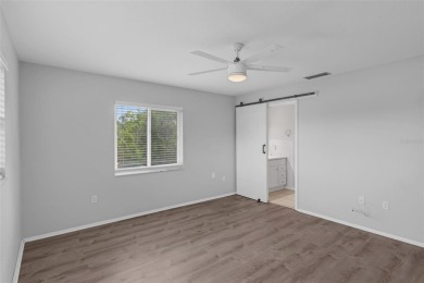 Move-in ready, fully remodeled Florida-style home on a corner on Oyster Creek Golf Club in Florida - for sale on GolfHomes.com, golf home, golf lot