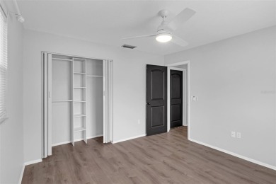 Move-in ready, fully remodeled Florida-style home on a corner on Oyster Creek Golf Club in Florida - for sale on GolfHomes.com, golf home, golf lot
