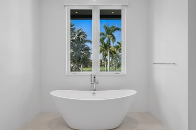 A contemporary, light-filled home on an oversized lot with 165 on Boca Raton Resort and Club in Florida - for sale on GolfHomes.com, golf home, golf lot