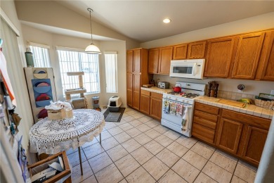 Charming 3 bed, 2 bath home built in 2001 with vaulted ceilings on Cerbat Cliffs Golf Course in Arizona - for sale on GolfHomes.com, golf home, golf lot