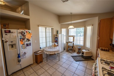 Charming 3 bed, 2 bath home built in 2001 with vaulted ceilings on Cerbat Cliffs Golf Course in Arizona - for sale on GolfHomes.com, golf home, golf lot