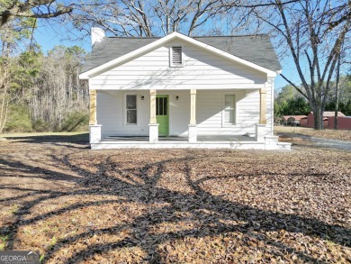 Location Location Location!  This three bedroom 2 bath farmhouse on Hickory Hills Golf Course in Georgia - for sale on GolfHomes.com, golf home, golf lot