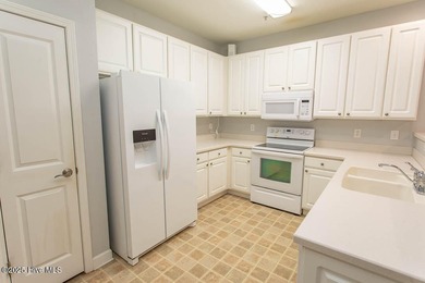 Perfect first floor 2BR/2BA beach condo priced to sell with on Crow Creek Golf Club in North Carolina - for sale on GolfHomes.com, golf home, golf lot