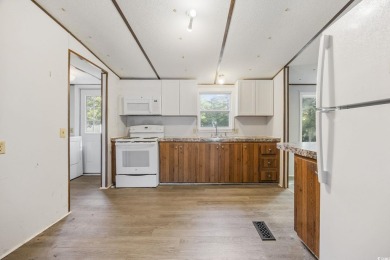 Discover your ideal beachside escape in the desirable Windjammer on Indian Wells Golf Course in South Carolina - for sale on GolfHomes.com, golf home, golf lot