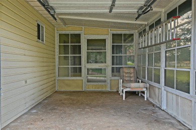 Priced Below Market--Investor or Handyman Special! This split on The Links of Spruce Creek in Florida - for sale on GolfHomes.com, golf home, golf lot