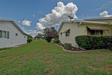 Priced Below Market--Investor or Handyman Special! This split on The Links of Spruce Creek in Florida - for sale on GolfHomes.com, golf home, golf lot