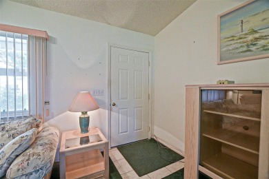 Priced Below Market--Investor or Handyman Special! This split on The Links of Spruce Creek in Florida - for sale on GolfHomes.com, golf home, golf lot