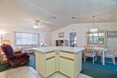 Priced Below Market--Investor or Handyman Special! This split on The Links of Spruce Creek in Florida - for sale on GolfHomes.com, golf home, golf lot