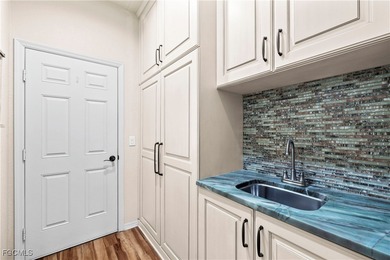 EXTRAS GALORE! FULLY CUSTOM LAKEFRONT LUXURY... MOVE-IN READY on Herons Glen Golf and Country Club in Florida - for sale on GolfHomes.com, golf home, golf lot