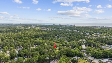 Discover your ideal beachside escape in the desirable Windjammer on Indian Wells Golf Course in South Carolina - for sale on GolfHomes.com, golf home, golf lot